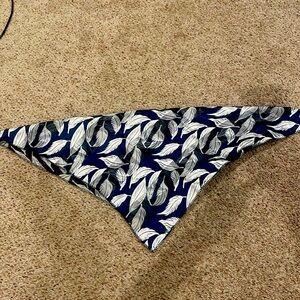 I’m selling a dark blue and white silk scarf.